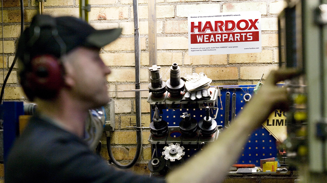 Worker at a Hardox Wearparts center about to process the steel.